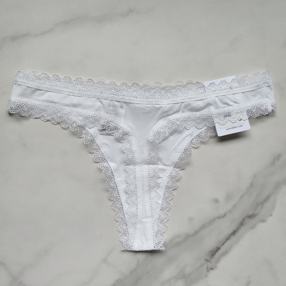 NWT CALVIN KLEIN FLIRTY MICRO THONG PANTY IN WHITE SIZE EXTRA LARGE - Picture 2 of 5